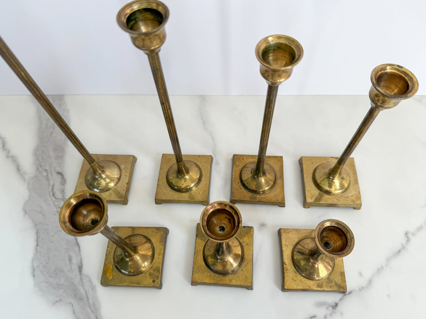 Set of Seven Brass Taper Candle Holders with Square Bases
