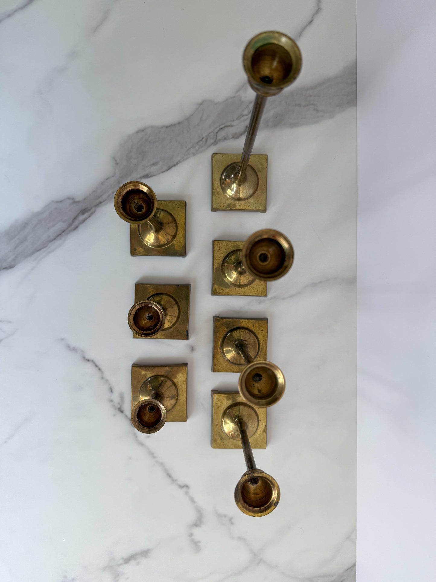 Set of Seven Brass Taper Candle Holders with Square Bases