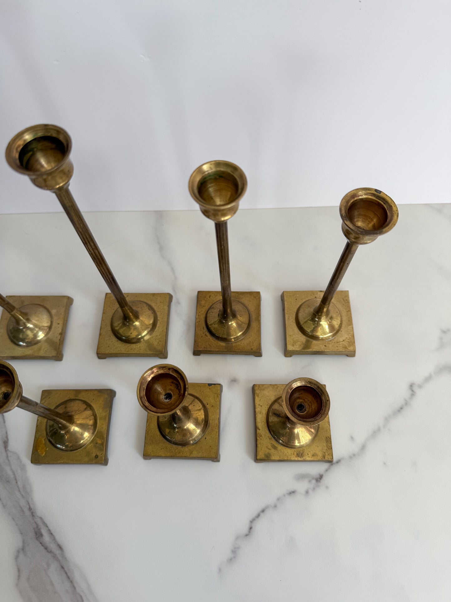 Set of Seven Brass Taper Candle Holders with Square Bases