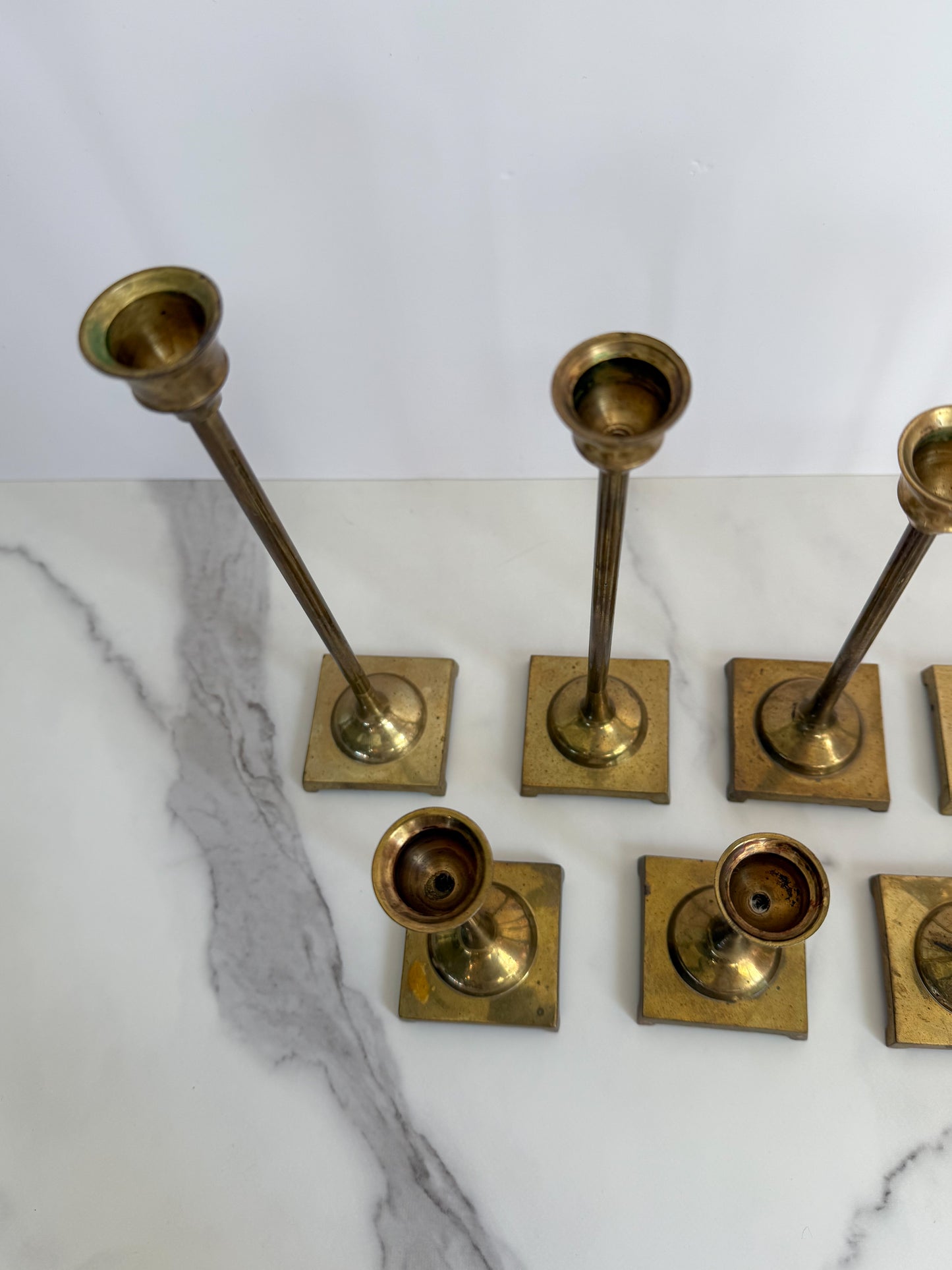 Set of Seven Brass Taper Candle Holders with Square Bases